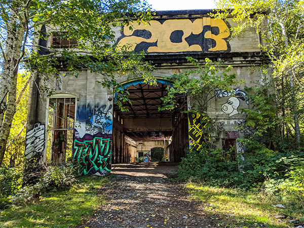 an abandoned power plant on Vancouver Island covered in graffiti.