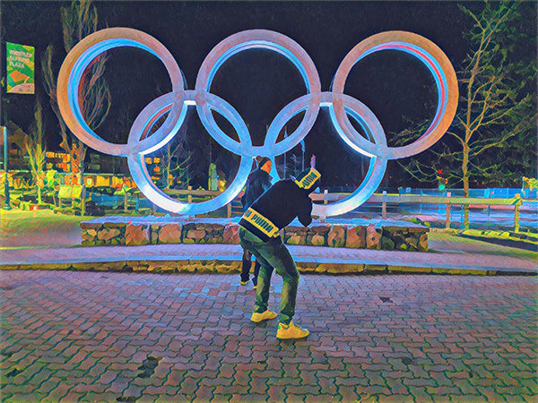 an altered photo of another photo being taken in front of the Olympic rings in Whistler.