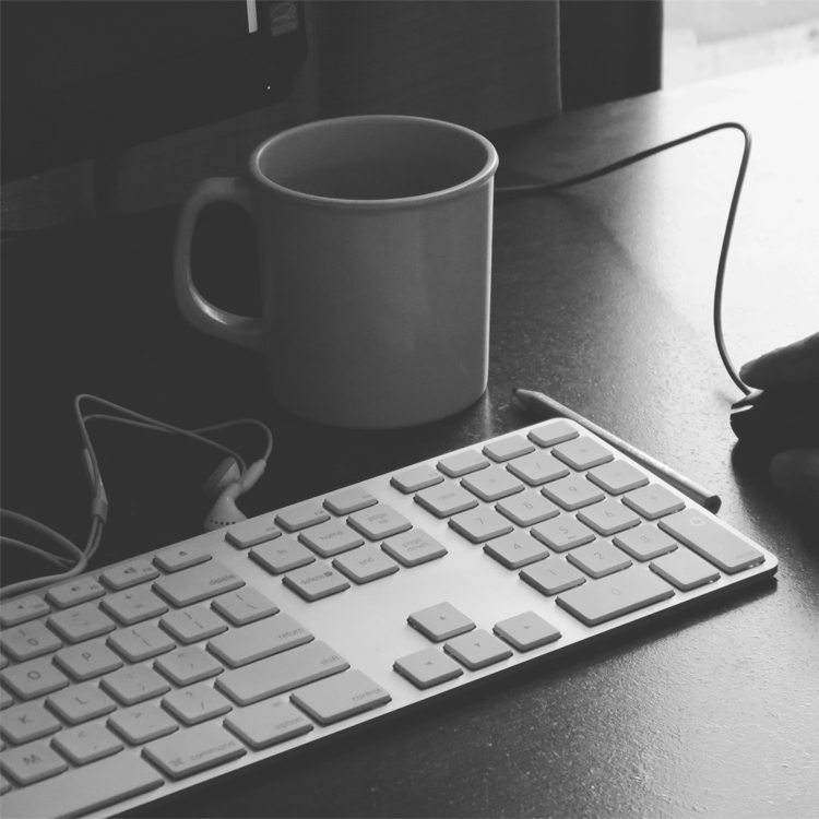 A keyboard and some coffee.